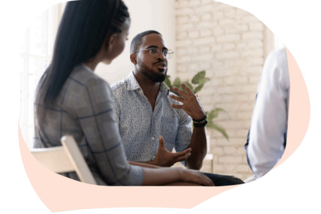 A couple speaking with a mental health counselor