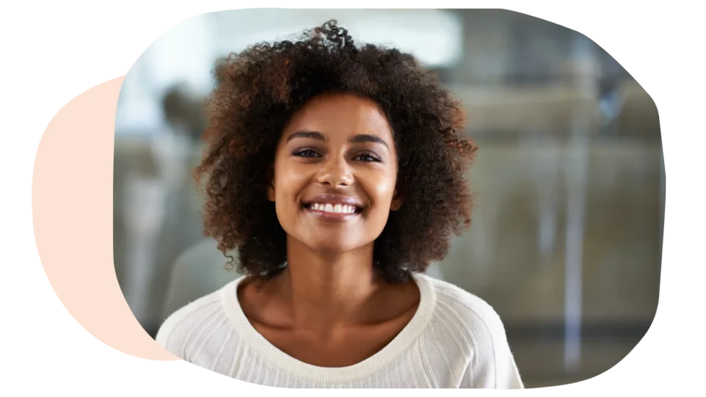Woman smiling after her outpatient mental health treatment